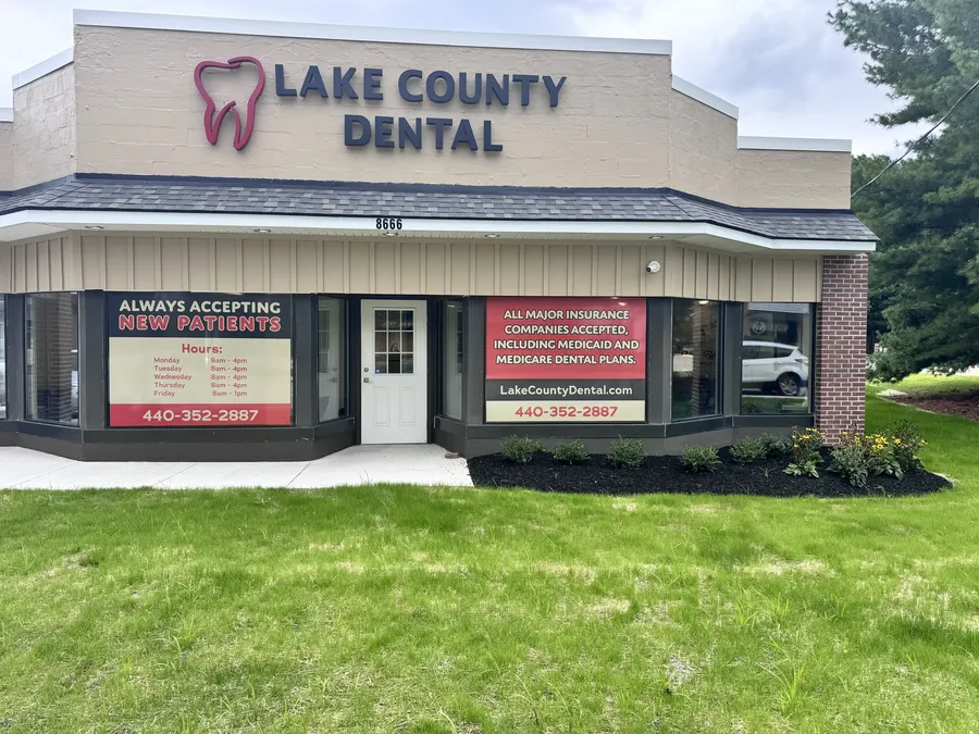 The Lake County Dental storefront with its tooth logo sign