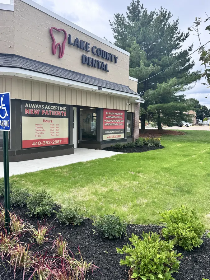 The office from the lawn, with the new patients banner in the window