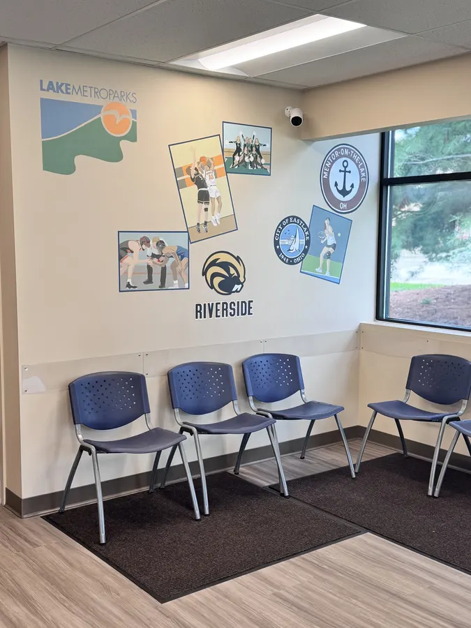 The waiting room wall with Lake Metroparks and local school artwork